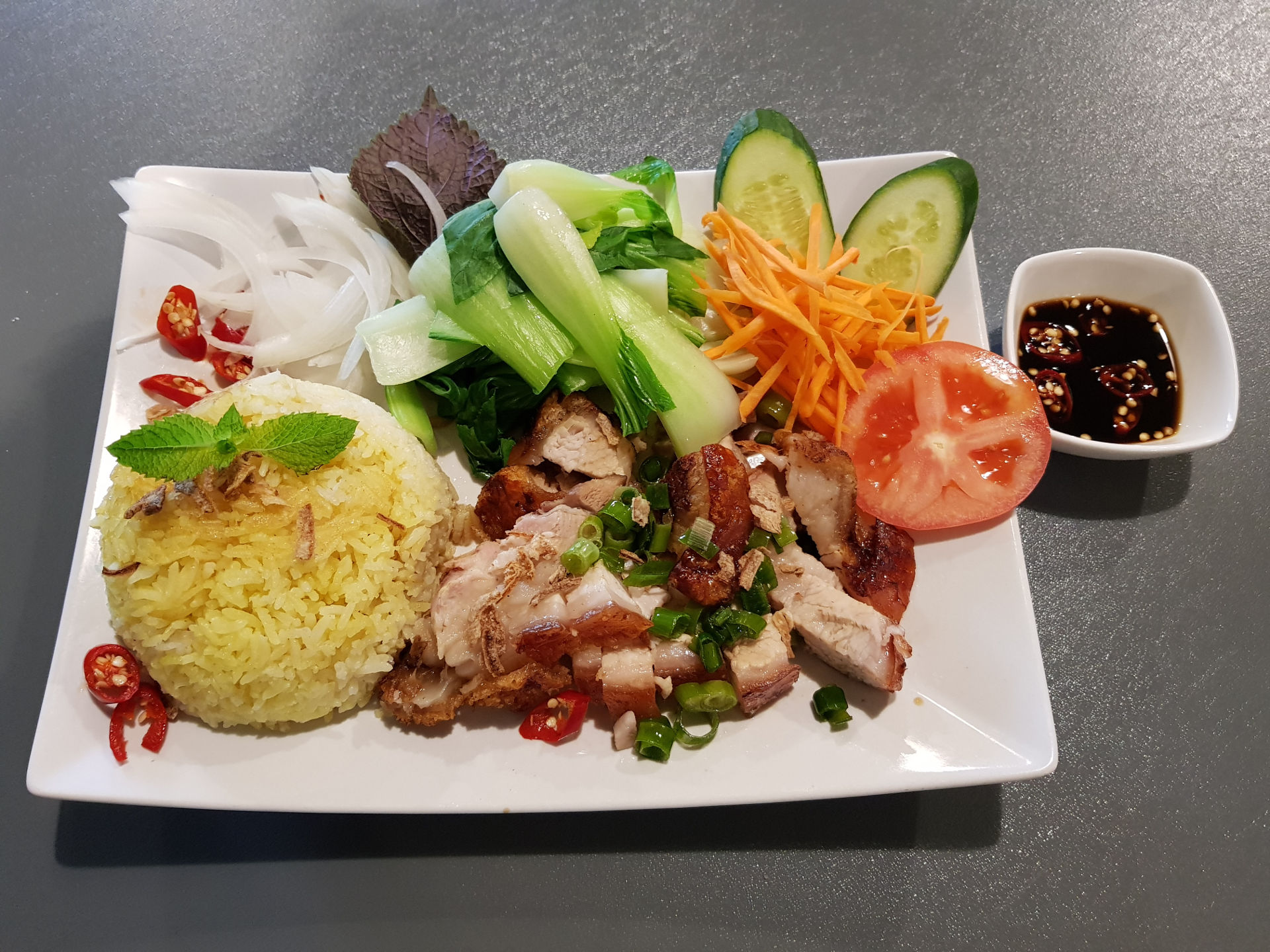 Chicken rice and roast pork belly.