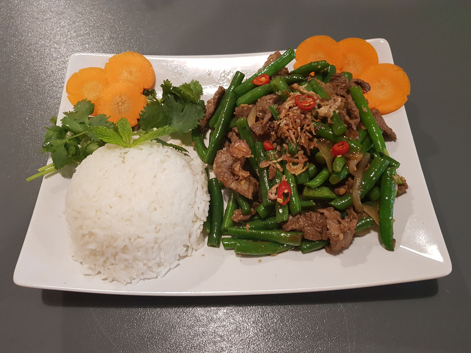 Wok tossed beef and green beans.