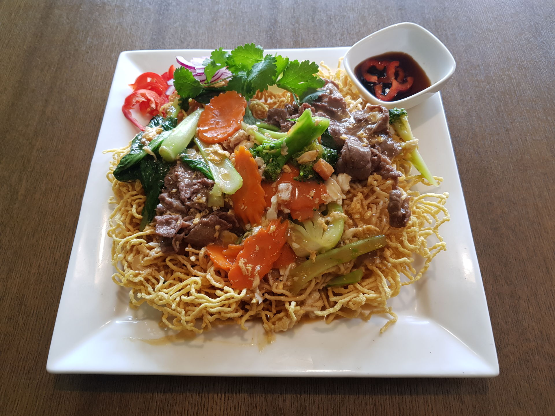 Beef and Crispy fried egg noodles.