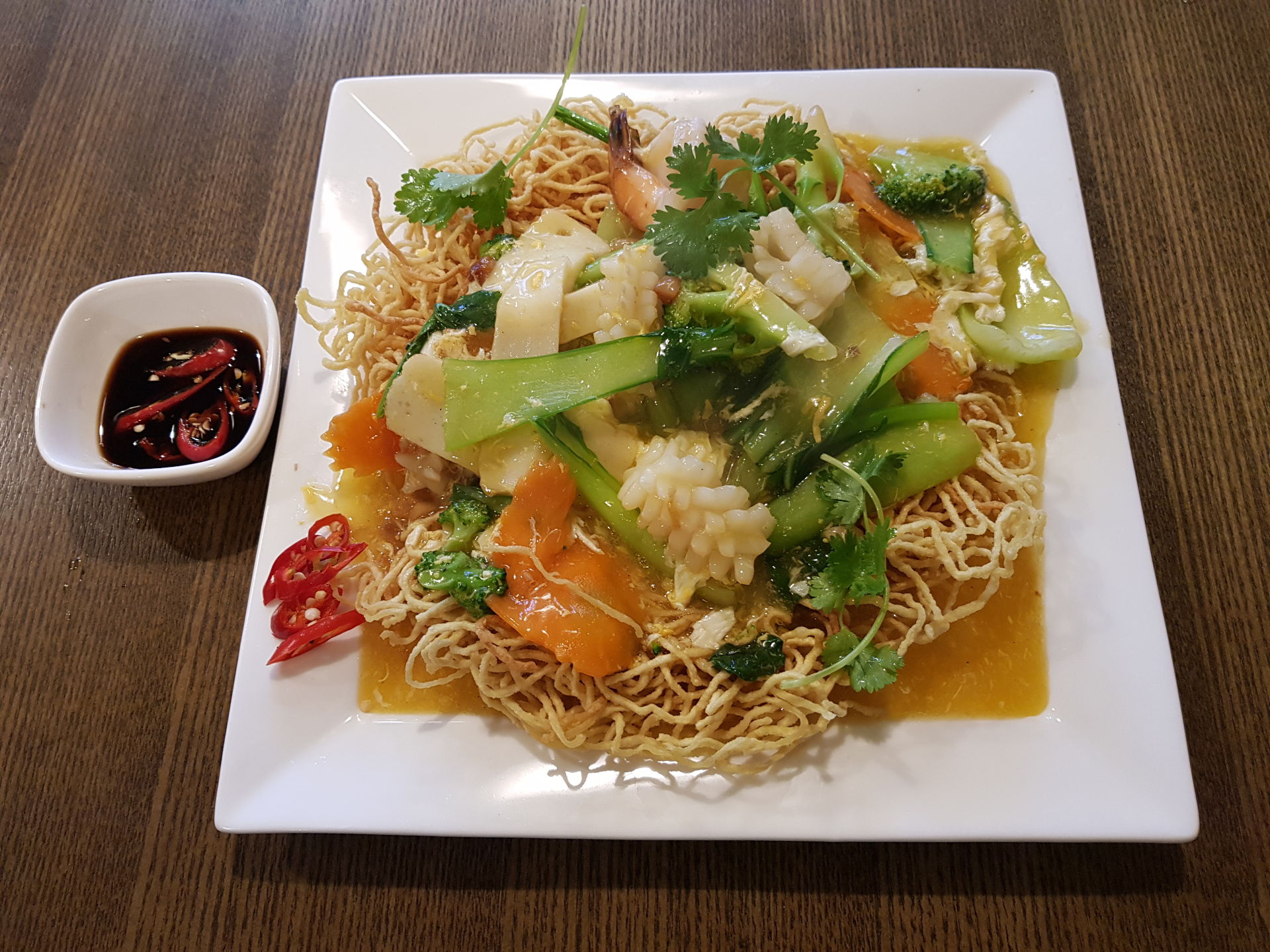 Stir fried seafood and vegetables with crispy noodles.