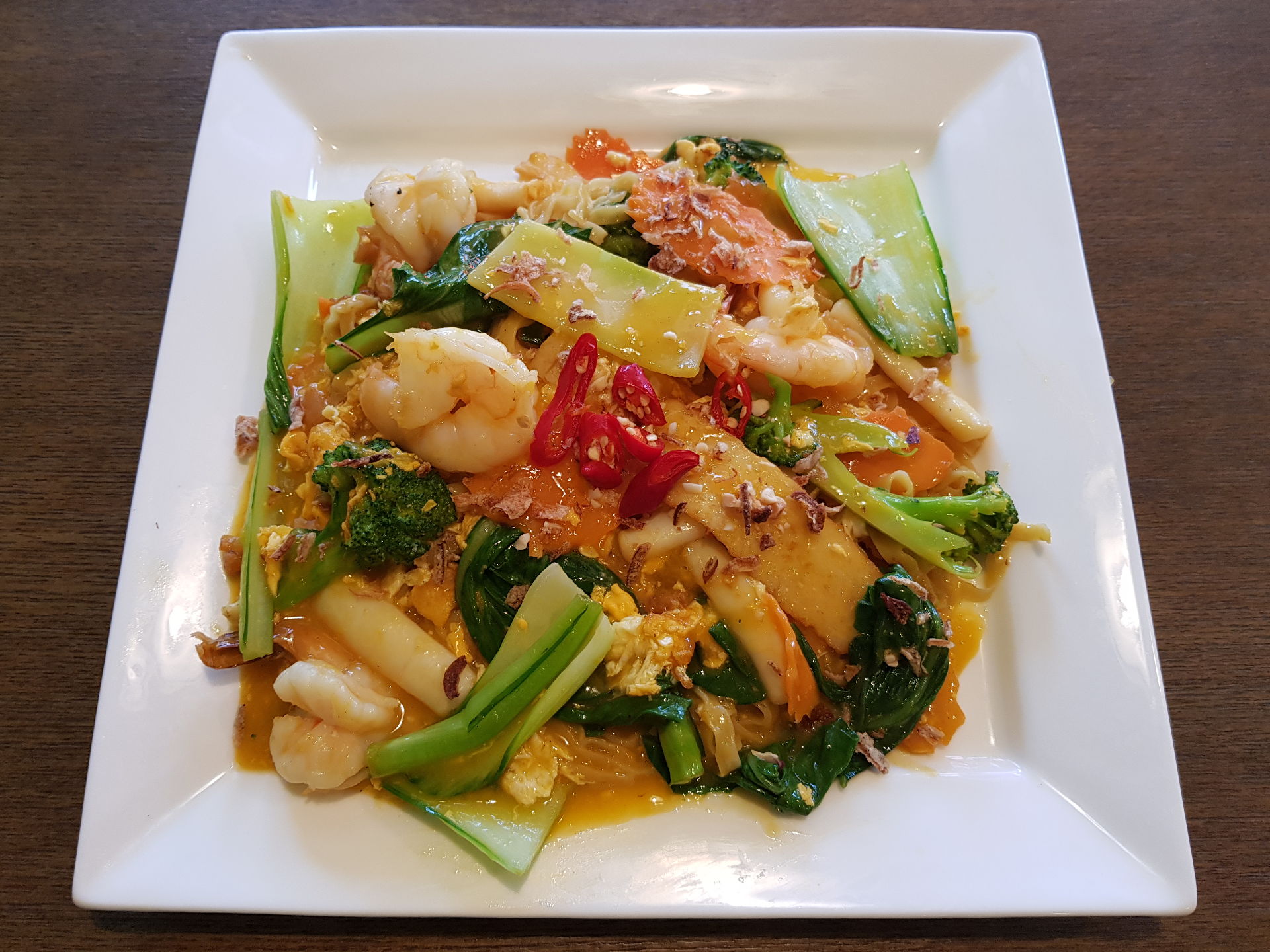 Seafood with soft egg noodles.
